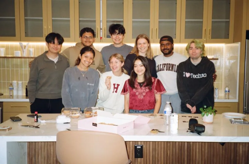 The Intelligence team gathered in their office kitchen